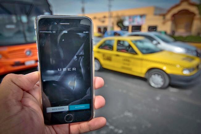 Multa a conductores de Uber por cobrar en efectivo: IQT