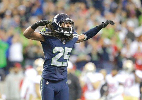 Sherman en contra de Harbaugh