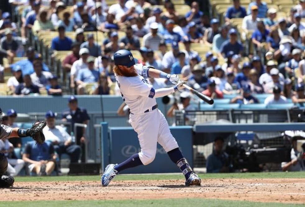 Justin Turner pegó dos cuadrangulares, uno de tres carreras (VICTOR DECOLONGON. AFP)